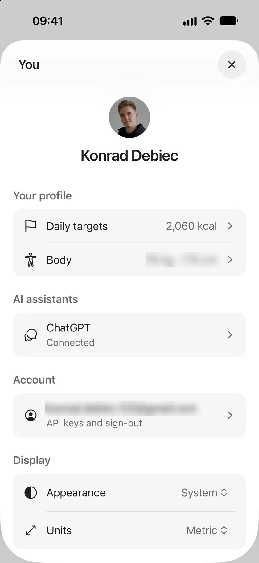 The You sheet: your name and picture, Your profile with Daily targets and Body, AI assistants with ChatGPT connected, your account, and Display with Appearance and Units.